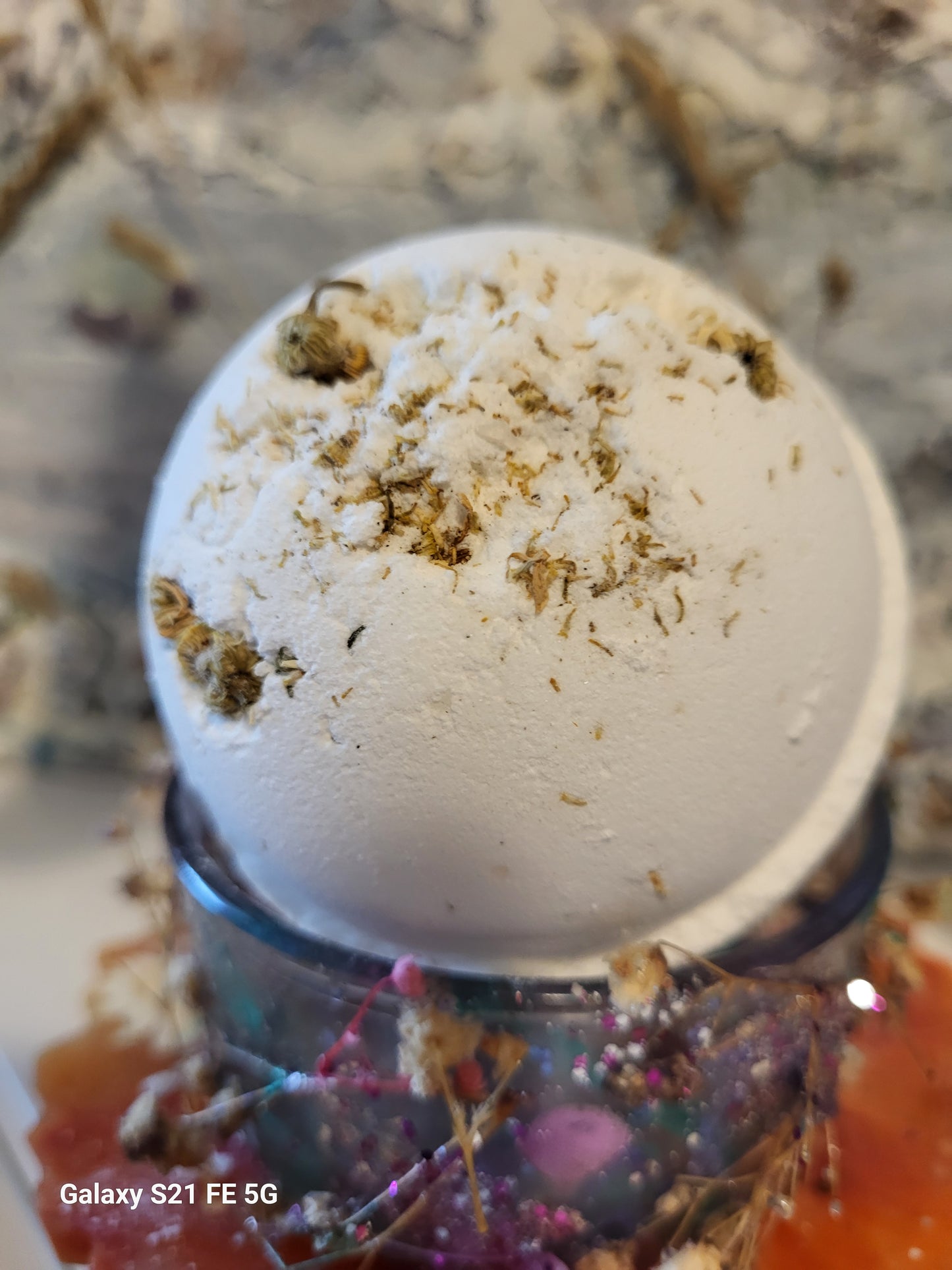 Bath Bomb Uplifting Geranium & Grapefruit with Chamomile flowers